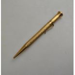 A 9ct yellow gold engine turned propelling pencil by Mordan Everpoint,
