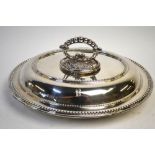 An oval silver entree dish and cover with detachable loop handle, Charles Boyton & Son Ltd.