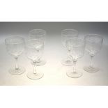 A set of six vintage wine glasses, the bowl etched with stars and a foliate band,