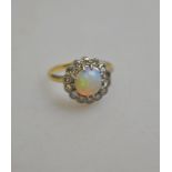 An opal and diamond circular cluster ring,