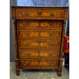 An 18th/19th century Dutch marquetry six drawer chest with mythical beast design to each flanked by