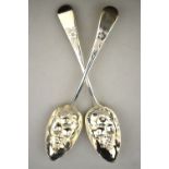 A pair of berry spoons of George II origin, with embossed bowls, 4.