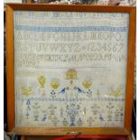 A Victorian needlework sampler, worked with alphabet and numerals, house, birds, people,