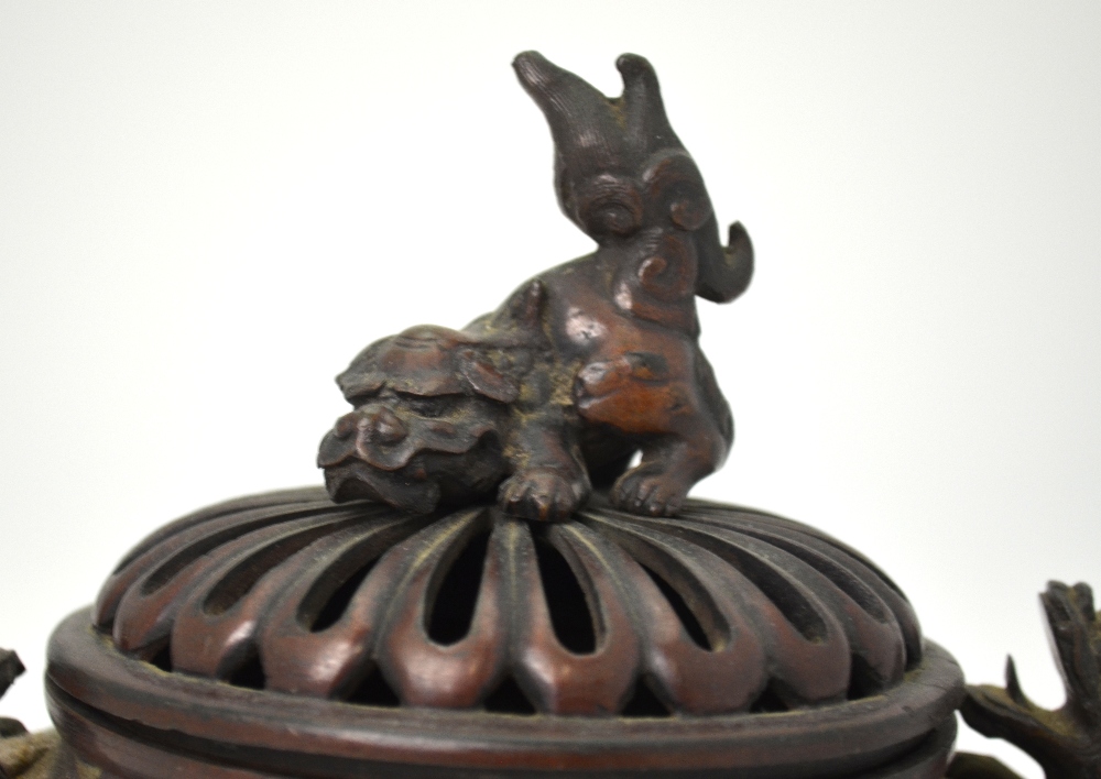 A Japanese bronze spherical censer on three feet with two handles formed as Shi Shi, - Image 2 of 5