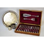 An Edwardian walnut-cased set of twelve each electroplated fish knives and forks with servers,