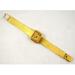 A lady's 18ct gold wristwatch by Asprey, with Baume & Mercier Swiss movement and octagonal dial,