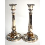 A pair of plated on copper baluster candlesticks,