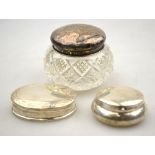 Two modern silver pill-boxes with hinged covers,