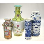 A Chinese Canton famille rose cylindrical vase decorated with panels of figures on a terrace,