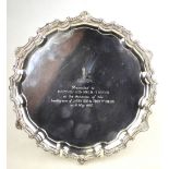 A heavy quality silver letter salver with moulded shell and scroll rim, on three scroll feet, C. J.