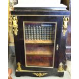 A Victorian white marble topped gilt mounted ebonised pier cabinet with fabric lined interior,