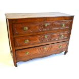 An 18th century French provincial oak commode,