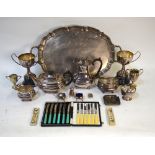 An electroplated oval tray, four-piece tea service, trophy cups, etc.