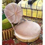 A late Victorian pink braided upholstered nursing chair of circular form,