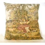 A large machined tapestry covered cushion depicting courting couple and an Indian cotton beaded and
