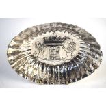 A Central American (possibly Mexican) white metal oval dish with reeded sides,