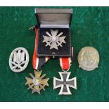 A German Third Reich Iron Cross 2nd class to/w a War Merit Cross 2nd Class (with swords,