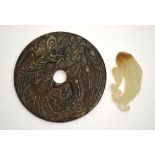 A Chinese Bi disk, stained hardstone carved with phoenix,