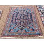 An old Persian Hamadan rug, the blue ground with repeating geometric design, 1.43 x 1.