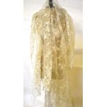 An early 20th century needle-run lace veil 160 x 195 cm with scalloped edge and two earlier pieces