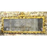 An 18th/19th century carved giltwood overmantel, the frame adorned with flower heads,