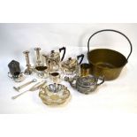 A four-piece tea service, a pair of candlesticks and other plated items,