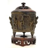 A Chinese bronze cylindrical censer cast with eight Daoist immortals and Shou Lau standing on