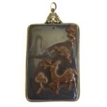 A Chinese agate rectangular pendant carved with a deer and long life symbols,