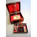 An interesting lot of jewellery in red morocco jewel box including coral bead necklace,