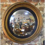 A Victorian gilt framed convex mirror,