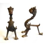 A pair of antique cast iron and brass fire dogs to/w a pair of hand forged fire tongs (3)