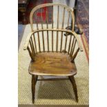 A 19th century elm hoop and stickback Windsor chair raised on turned legs united by turned