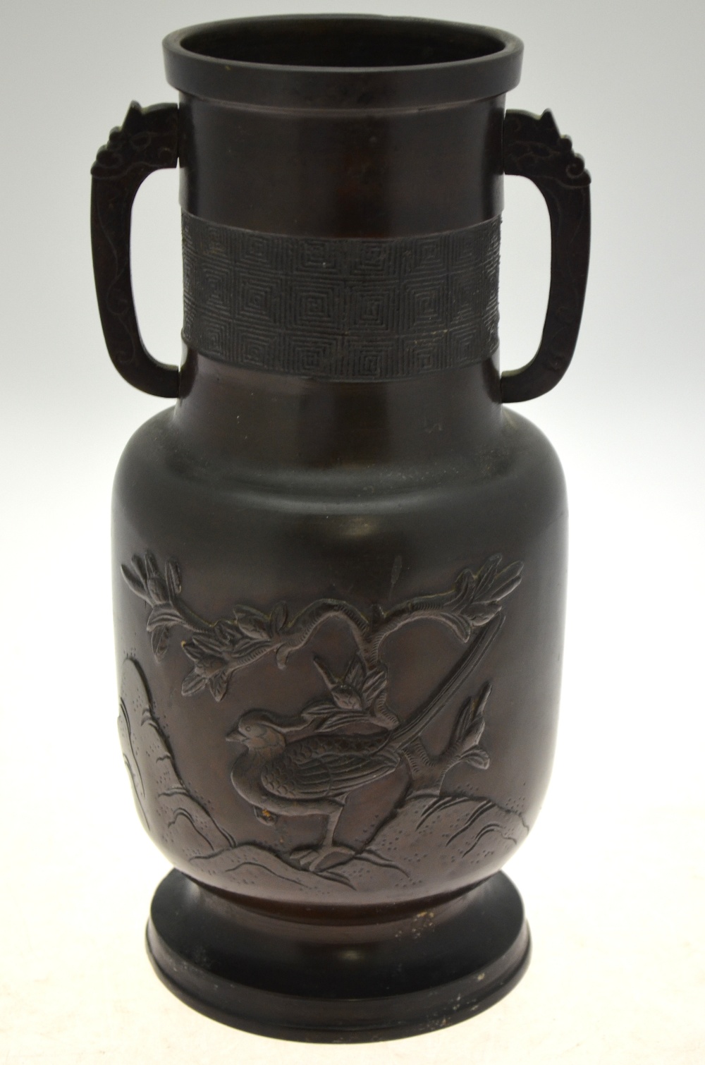 A Chinese bronze vase of cylindrical form cast with birds, rockwork and a tree, 19th century,