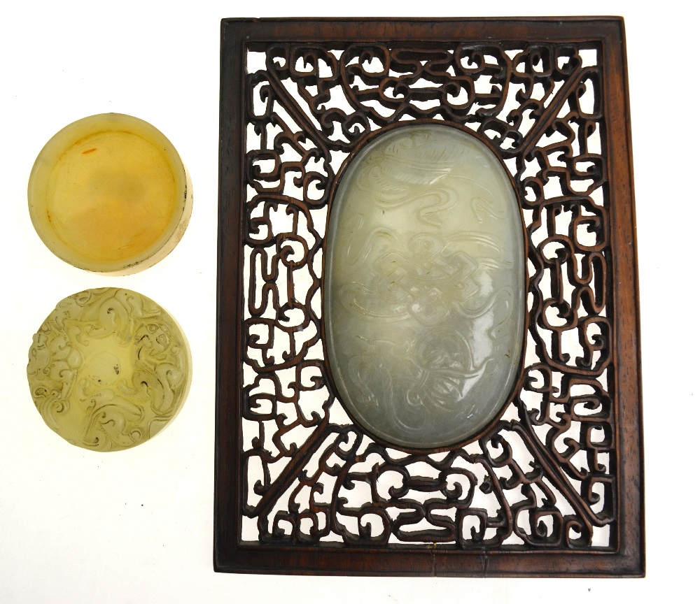 A Chinese oval pale jade plaque carved in shallow relief with auspicious objects (11. - Image 3 of 6