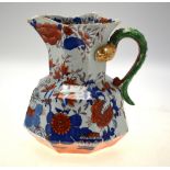 A mid 19th century Masons Ironstone Imari decorated octagonal water jug with serpent formed handle,