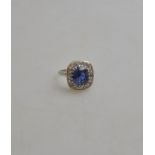 A Ceylon sapphire and diamond cluster ring,