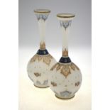 A pair of 19th century Continental opaque glass vases of spherical form with long flared necks and