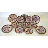 Nine Victorian Crown Derby dinner plates decorated in the Imari style, pattern 524, 26.5 cm diam.