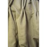 A pair of lined and inter-lined light green woven curtains, unused,