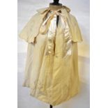 A Victorian fine grain cream floral embroidered silk cloak with fixed shoulder cape,