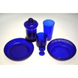 A Bristol blue glass canister and cover, a pierced glass bowl and plain bowl,