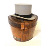 A Moss Bros grey felt top hat,