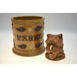 An unusual 19th century stoneware salt glazed pot and cover in the form of a rough coated terrier