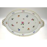 A Meissen porcelain oval tray painted with polychrome floral sprays, 44.