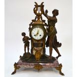 A French gilt bronze patinated spelter figural mounted drum mantel clock,