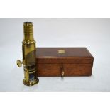 A Victorian lacquered brass barrel microscope by Lennie of Edinburgh in fitted teak box with a