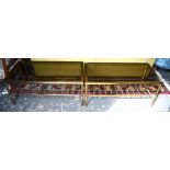 A pair of lacquered brass framed coffee/occasional tables with glass tops over a rail undertier,