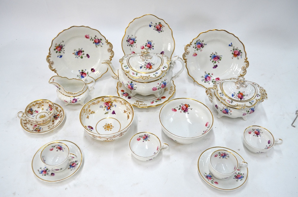 A Ridgway part tea service decorated with polychrome floral sprays and sprigs with gilt moulded