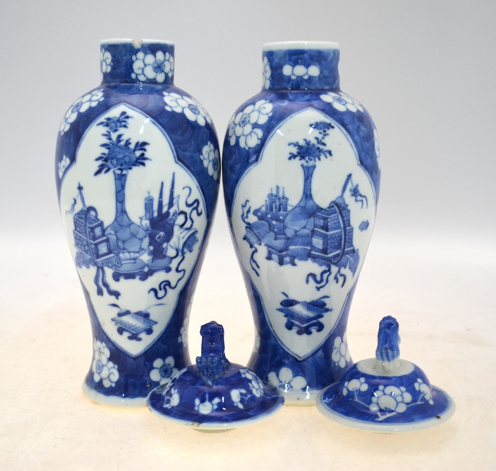 A pair of blue and white vases and covers; 26 cm high; each base with a Kangxi four-character mark, - Image 4 of 8