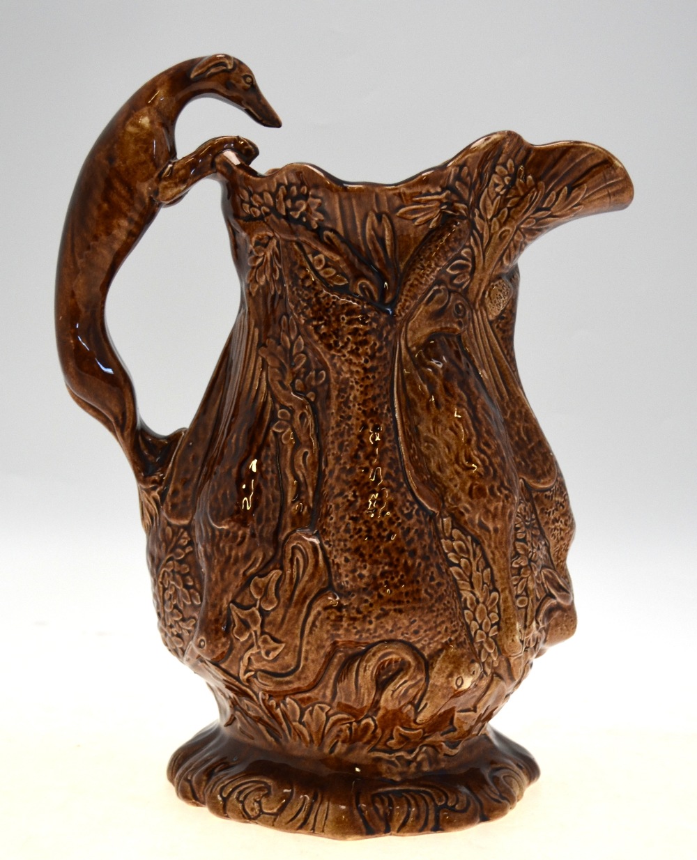 A 19th century brown glazed jug moulded with game - rabbits, ducks, fox, etc. - Image 2 of 5